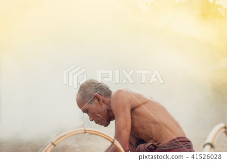 Uncle Asian fisherman with wicker tools. Uncle Asian fisherman with wicker tools. 41526028