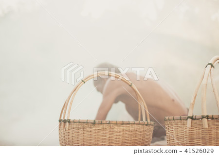 Uncle Asian fisherman with wicker tools. 41526029