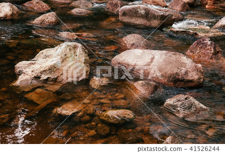 Tropical river flowing rapid water rocks landscape Tropical river flowing rapid water rocks landscape 41526244