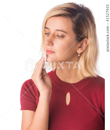 Woman Cleaning Face with white cotton pad. Woman Cleaning Face with white cotton pad. 41527935