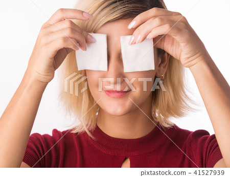 Woman Cleaning Face with white cotton pad. Woman Cleaning Face with white cotton pad. 41527939