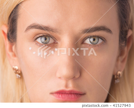 Eye cream treatment. Close up of green eye woman Eye cream treatment. Close up of green eye woman 41527943