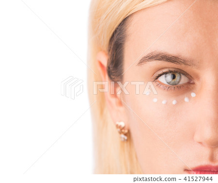 Eye cream treatment. Close up of green eye woman Eye cream treatment. Close up of green eye woman 41527944