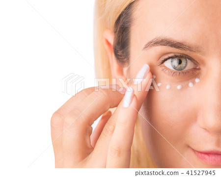 Eye cream treatment. Close up of green eye woman Eye cream treatment. Close up of green eye woman 41527945