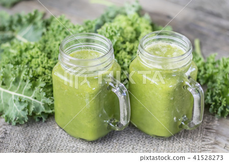 Nutritional smoothie of fresh organic curly green kale with tang Nutritional smoothie of fresh organic curly green kale with tang 41528273