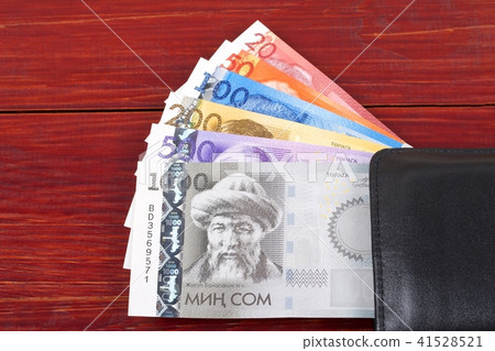 Kyrgiz money in the black wallet Kyrgiz money in the black wallet 41528521
