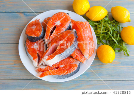fresh raw salmon steaks with lemon fresh raw salmon steaks with lemon 41528815