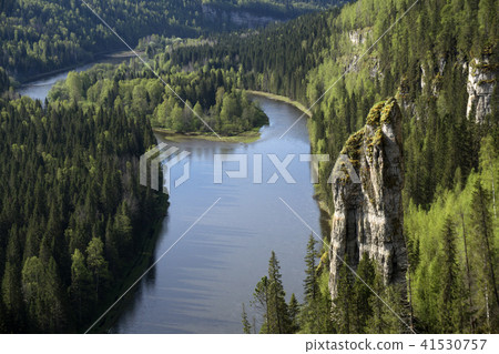 wooded river valley with rocks 41530757