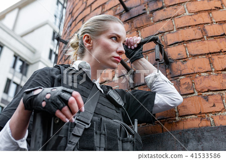 Powerful Woman Holding Gun. War Action Movie Style Powerful Woman Holding Gun. War Action Movie Style 41533586