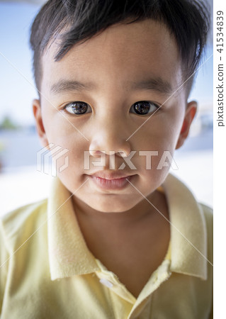 close up face asian children looking eyes contact 41534839