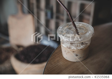 cappuccino or Latte art coffee made from milk on the wood table in coffee shop 41535068