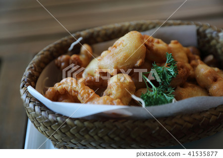 Calamari rings , fried squid on wood background , Italian food Calamari rings , fried squid on wood background , Italian food 41535877