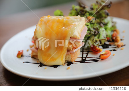 Ham cheese sandwich with salad on wood background 41536228
