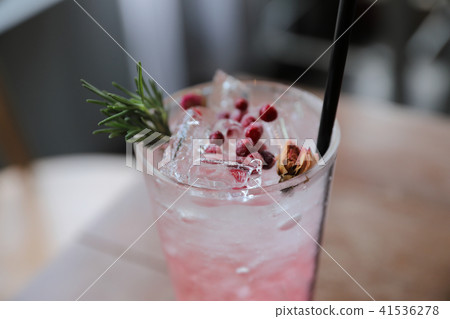 Strawberry juice cocktail with soda on wood background Strawberry juice cocktail with soda on wood background 41536278