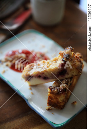 Dessert Blueberry cheese cake with strawberry jam on wood table background Dessert Blueberry cheese cake with strawberry jam on wood table background 41536497