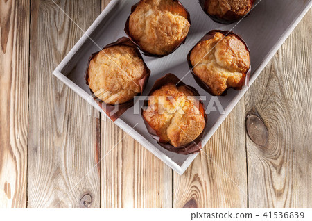 Vanilla muffins on a wooden background. Top view Vanilla muffins on a wooden background. Top view 41536839