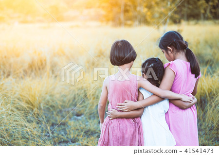 three asian child girl hugging to each other three asian child girl hugging to each other 41541473