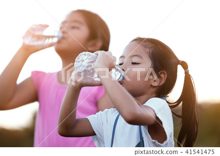 asian child girl drinking fresh water from bottle asian child girl drinking fresh water from bottle 41541475