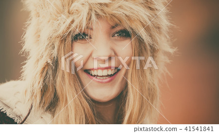 Portrait of pretty fashion woman in fur winter hat Portrait of pretty fashion woman in fur winter hat 41541841