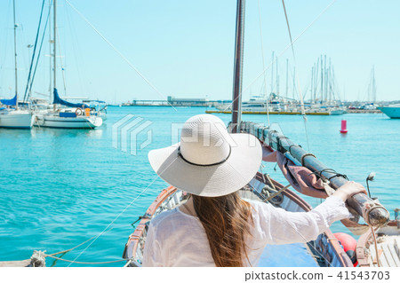 Beautiful Young Caucasian Woman in Hat at Ocean 41543703