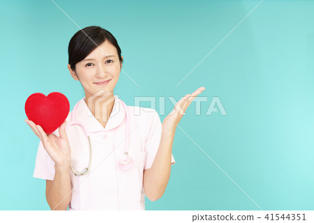 A smiling nurse with a heart mark A smiling nurse with a heart mark 41544351