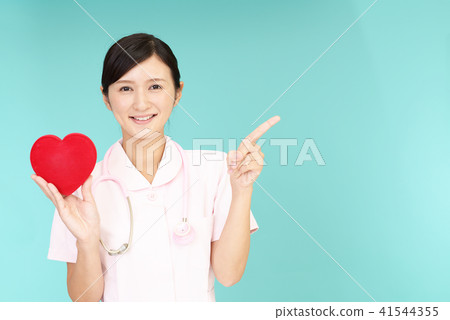 A smiling nurse with a heart mark A smiling nurse with a heart mark 41544355