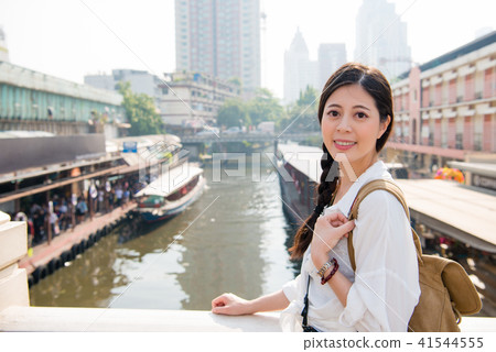 woman holding the side of the bridge woman holding the side of the bridge 41544555