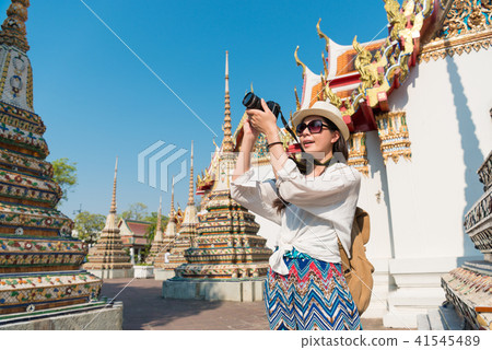 woman taking photo in the street woman taking photo in the street 41545489