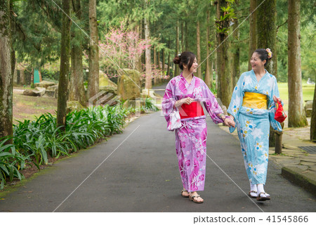 woman holding their hands and taking a walk woman holding their hands and taking a walk 41545866