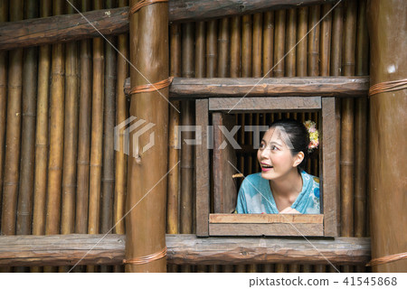 woman stayed inside the bamboo made building woman stayed inside the bamboo made building 41545868