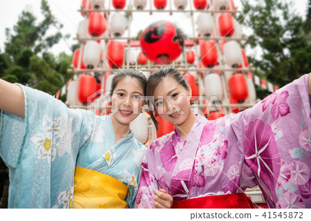 Asian young ladies holding hands together 41545872
