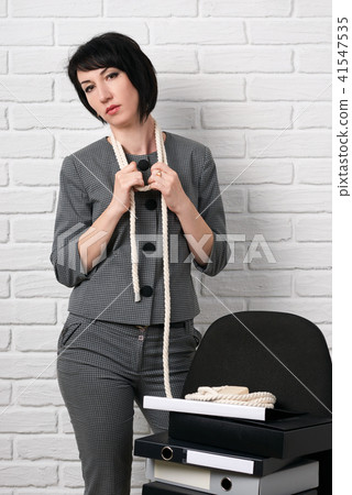 business woman dressed in a gray suit poses business woman dressed in a gray suit poses 41547535