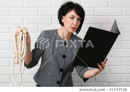business woman dressed in a gray suit poses business woman dressed in a gray suit poses 41547536