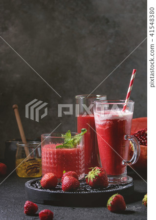 Red fruit cocktails or smoothies Red fruit cocktails or smoothies 41548380