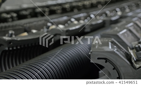 Manufacture of plastic water pipes. Manufacturing of tubes to the factory. The process of making Manufacture of plastic water pipes. Manufacturing of tubes to the factory. The process of making 41549651