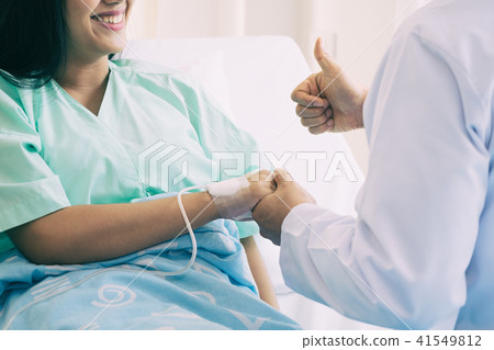 Hand of man doctor reassuring patient Hand of man doctor reassuring patient 41549812