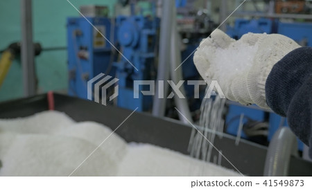 Manufacture of plastic water pipes. Special open container with plastic granules. Manufacturing of Manufacture of plastic water pipes. Special open container with plastic granules. Manufacturing of 41549873