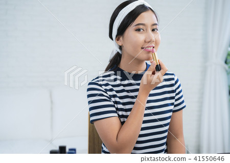 Beauty blogger present cosmetic for record video. Beauty blogger present cosmetic for record video. 41550646