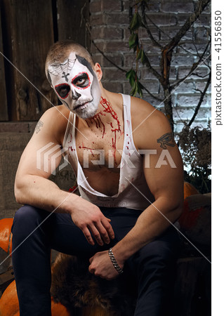 Male daemon with axe near firewood placing 41556850