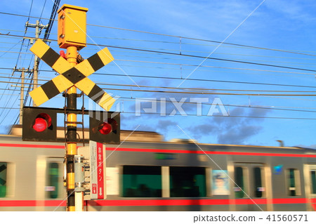 A train passing through a railroad crossing A train passing through a railroad crossing 41560571