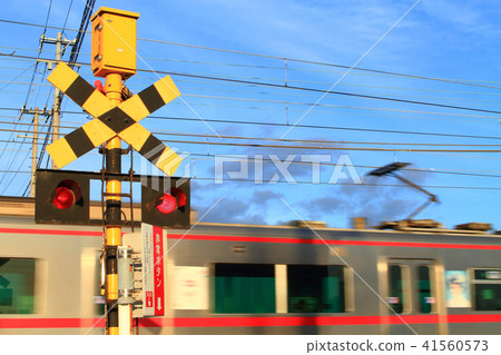 A train passing through a railroad crossing 41560573