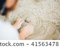 Children's playing in the sand 41563478