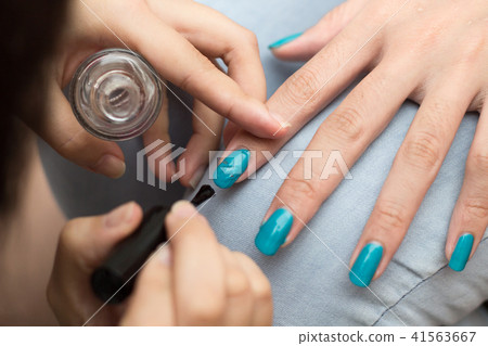 Blue nail polish 41563667