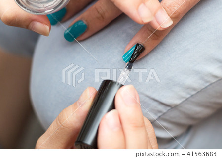 Blue nail polish 41563683