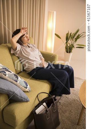 A young lady who got home tired A young lady who got home tired 41567187