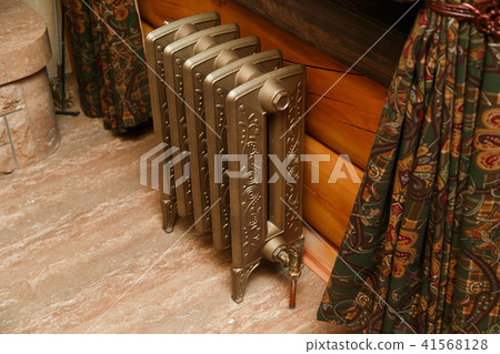 Retro styled cast iron radiator with valve and copper pipe 41568128