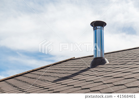 Chimney pipe from stainless steel on the roof of the house 41568401