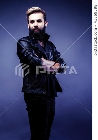portrait of young bearded hipster guy on gray dark background cl portrait of young bearded hipster guy on gray dark background cl 41569398