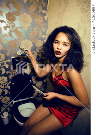 pretty young african american woman in luxury restroom with mone pretty young african american woman in luxury restroom with mone 41569697