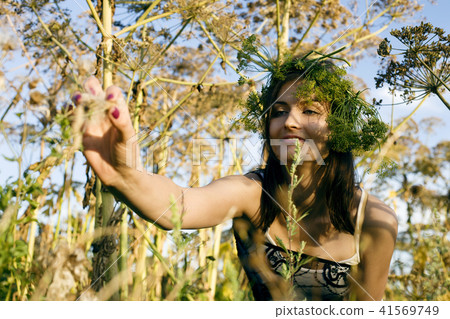 happy blond young woman in green spring park smiling, lifestyle happy blond young woman in green spring park smiling, lifestyle 41569749